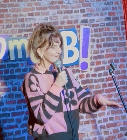 Sara Louise Aston performing standup